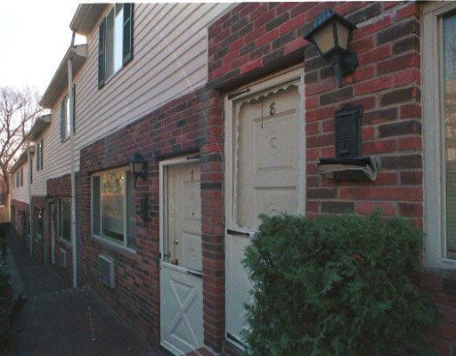 463 Cove Road, Unit 7 Stamford, CT 06902 - Photo 1 of 1 a view of a brick house with a small space