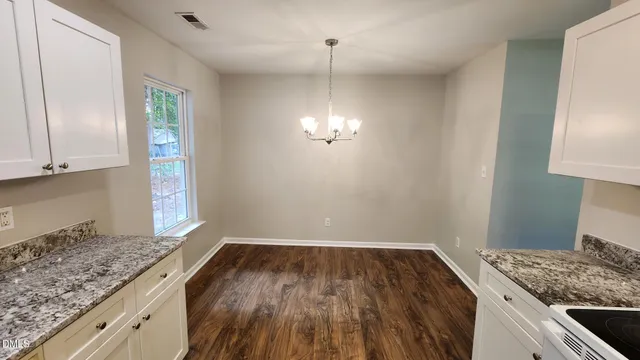 a view of kitchen and wooden floor