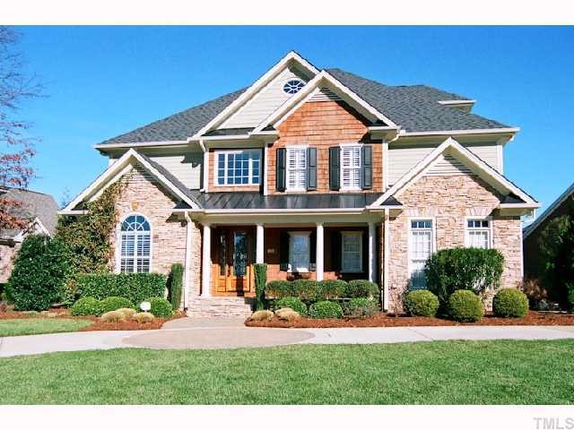 1629 Stannard Trail Raleigh, NC 27612 - Photo 1 of 12 a front view of a house with a yard and potted plants