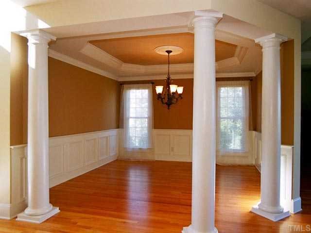 1629 Stannard Trail Raleigh, NC 27612 - Photo 3 of 12 a view of a hallway with wooden floor and a living room