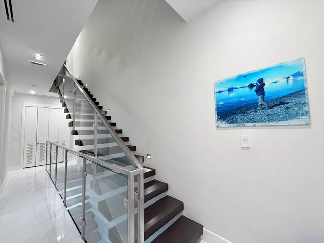 a balcony with wooden floor and lake view