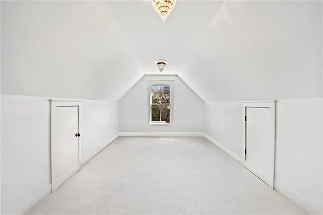 a view of an house with backyard and a tree