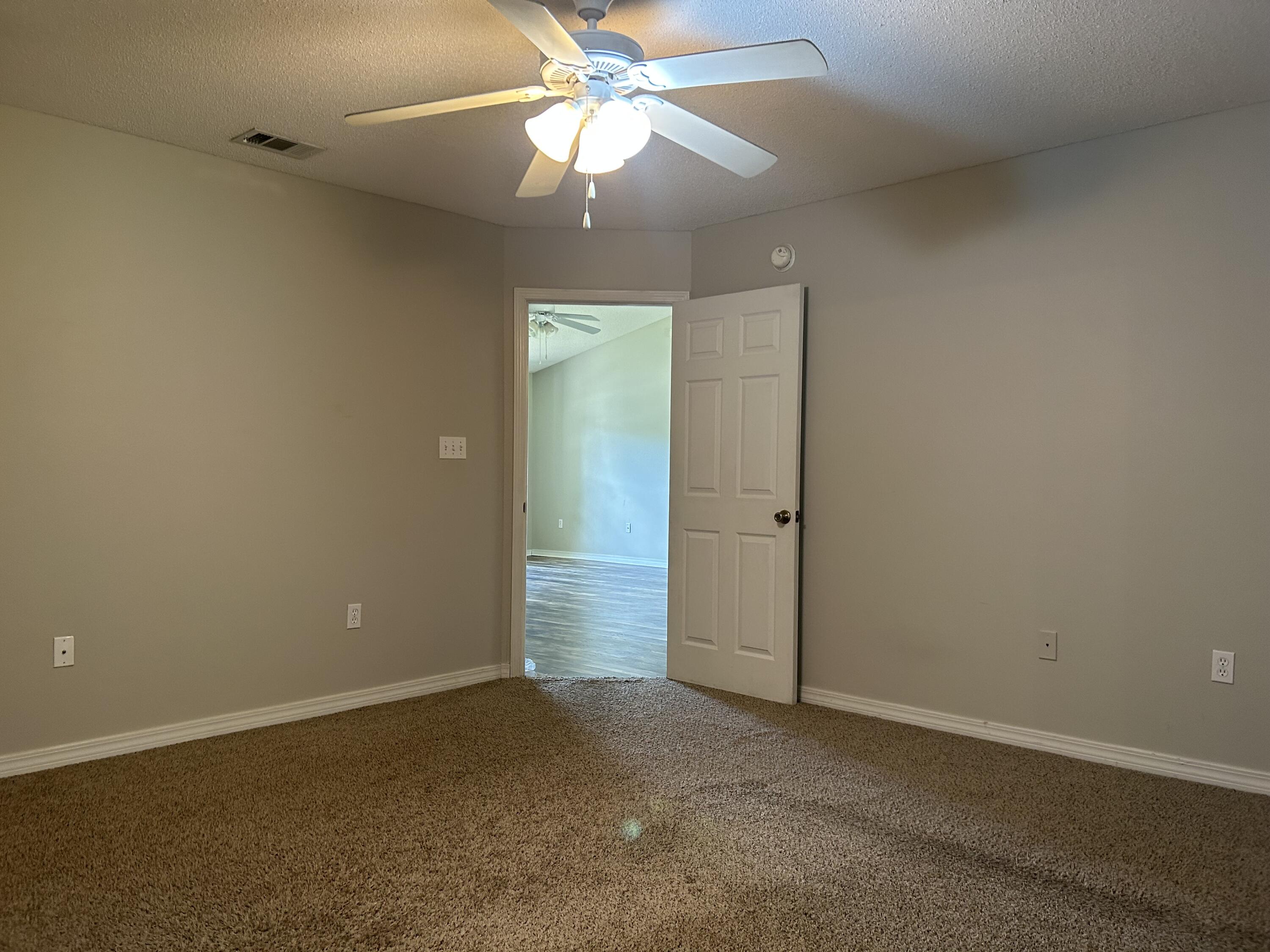203 Cabana Way Crestview, FL 32536 - Photo 13 of 25 an empty room with closet and a ceiling fan
