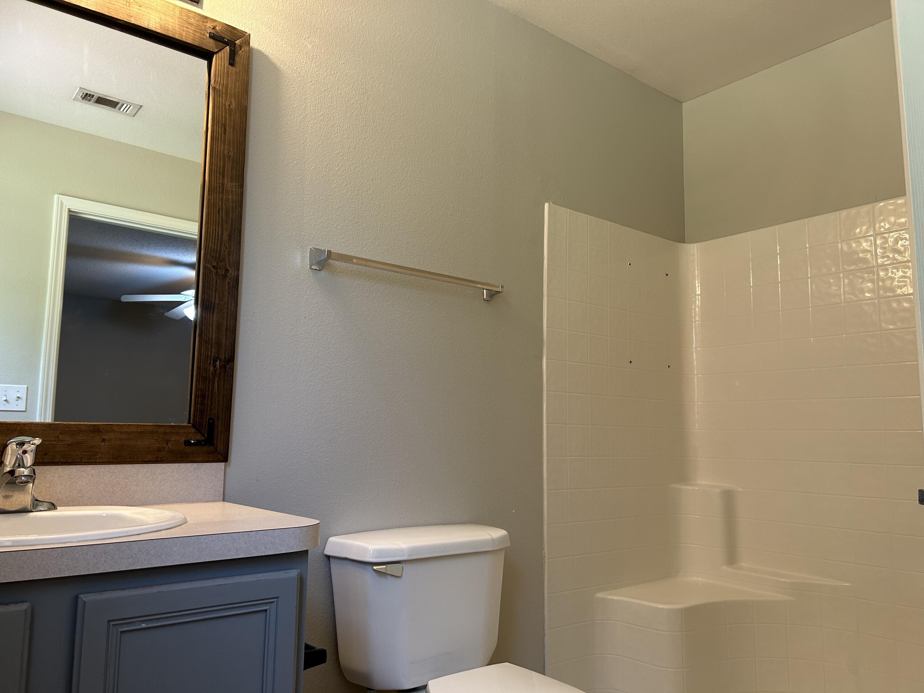 203 Cabana Way Crestview, FL 32536 - Photo 16 of 25 a bathroom with a sink a toilet and shower