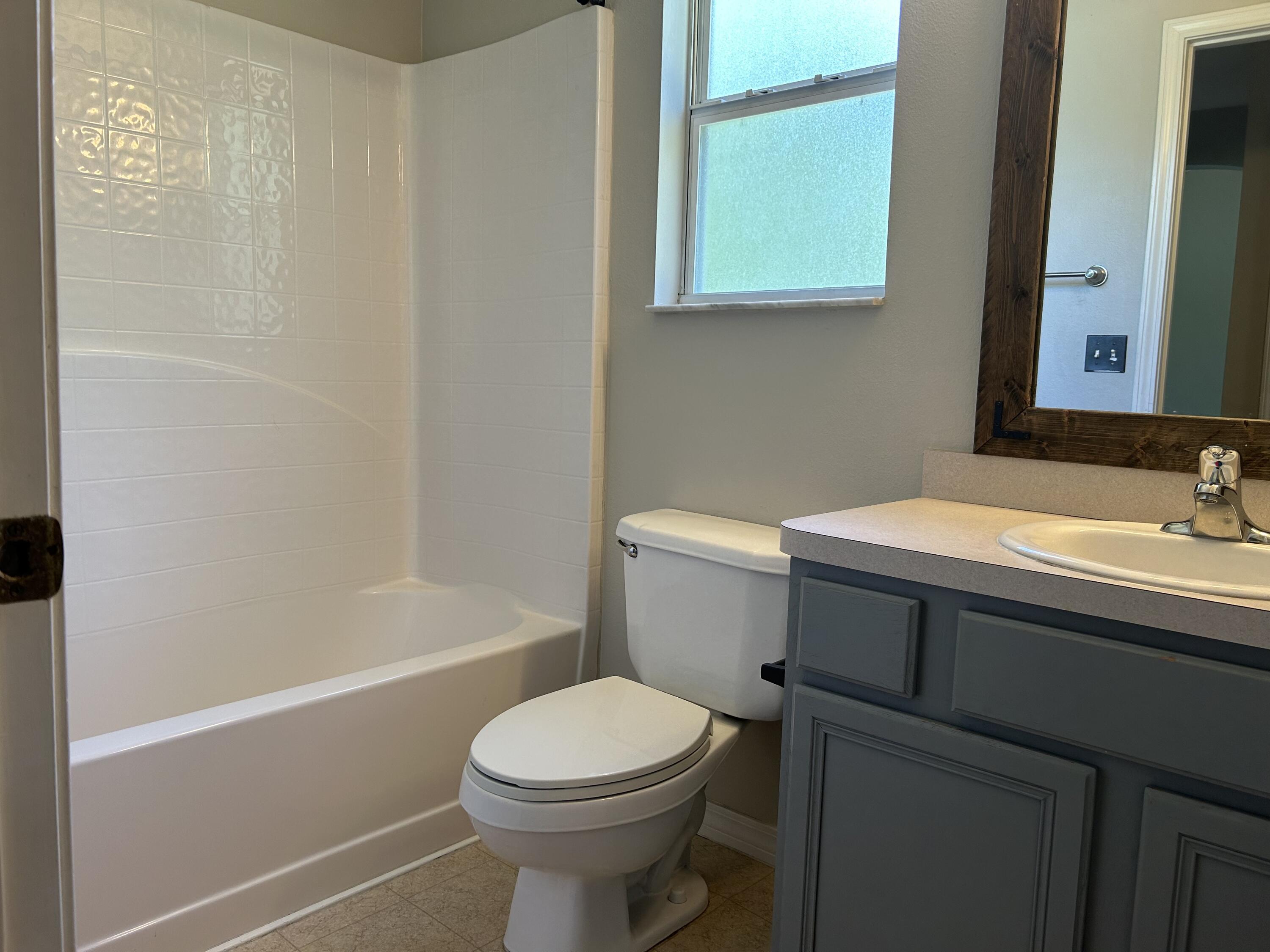 203 Cabana Way Crestview, FL 32536 - Photo 20 of 25 a bathroom with a sink a toilet and shower