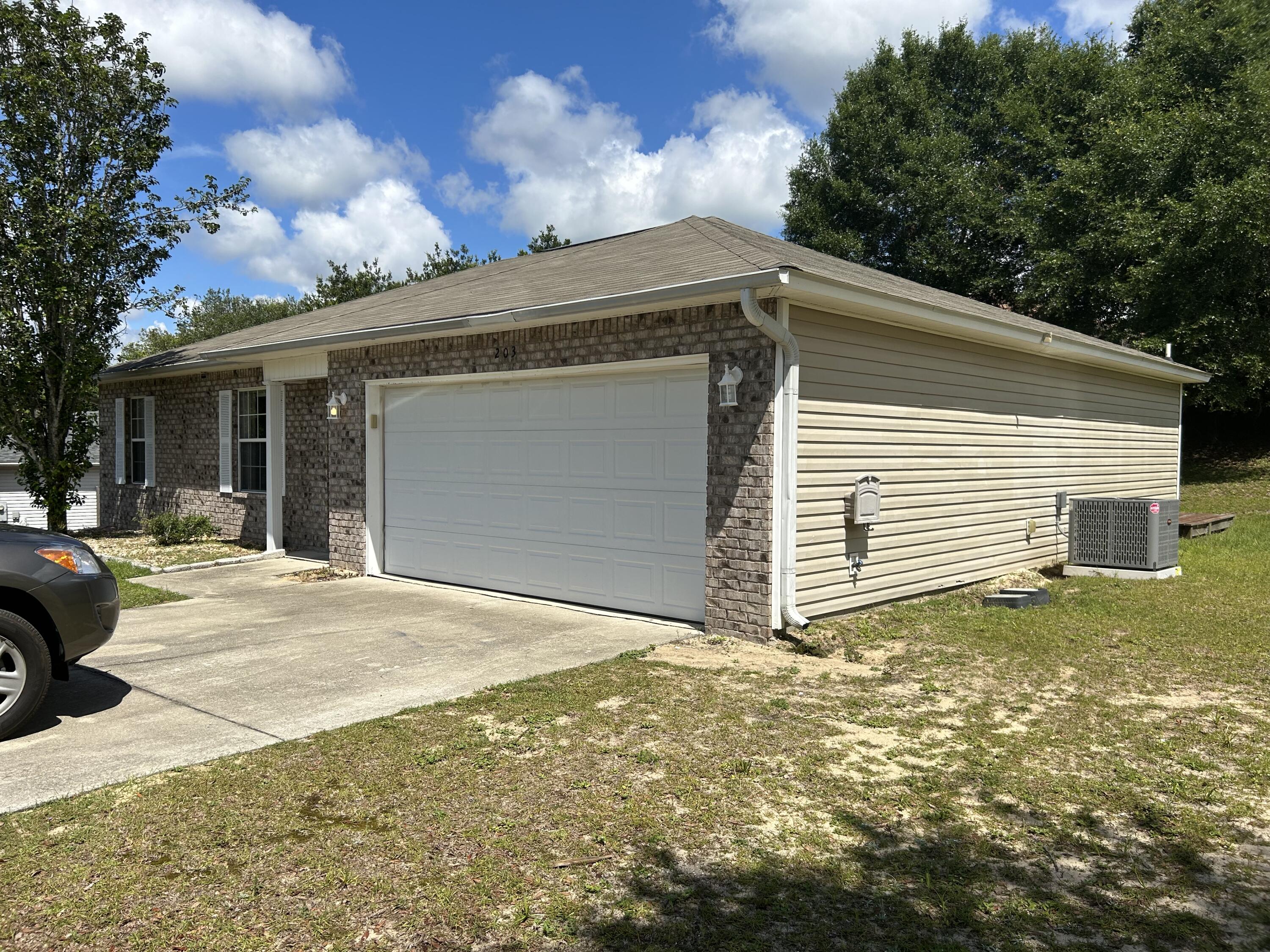 203 Cabana Way Crestview, FL 32536 - Photo 22 of 25 a view of a house with a yard