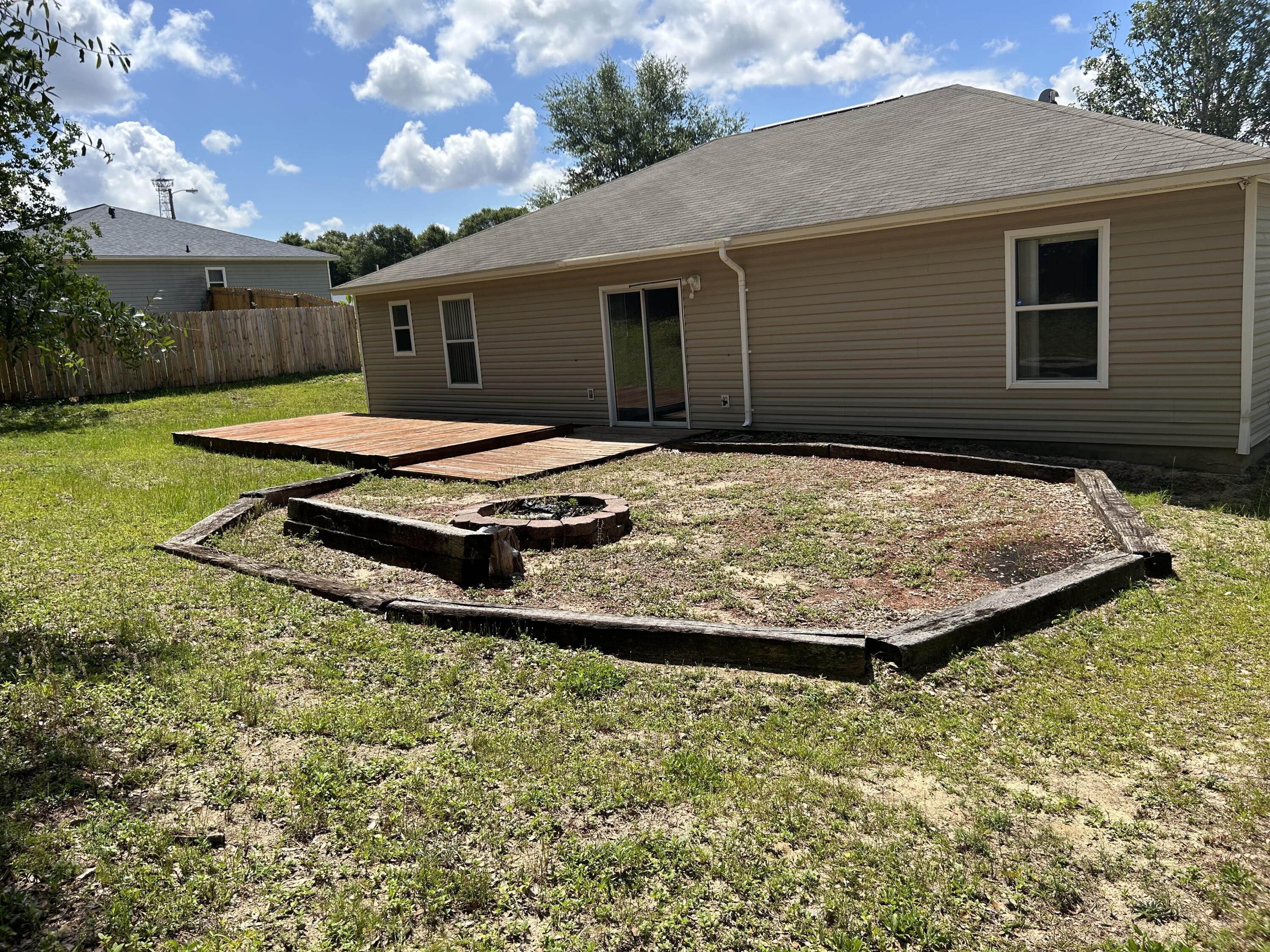 203 Cabana Way Crestview, FL 32536 - Photo 25 of 25 a view of a house with backyard and sitting area