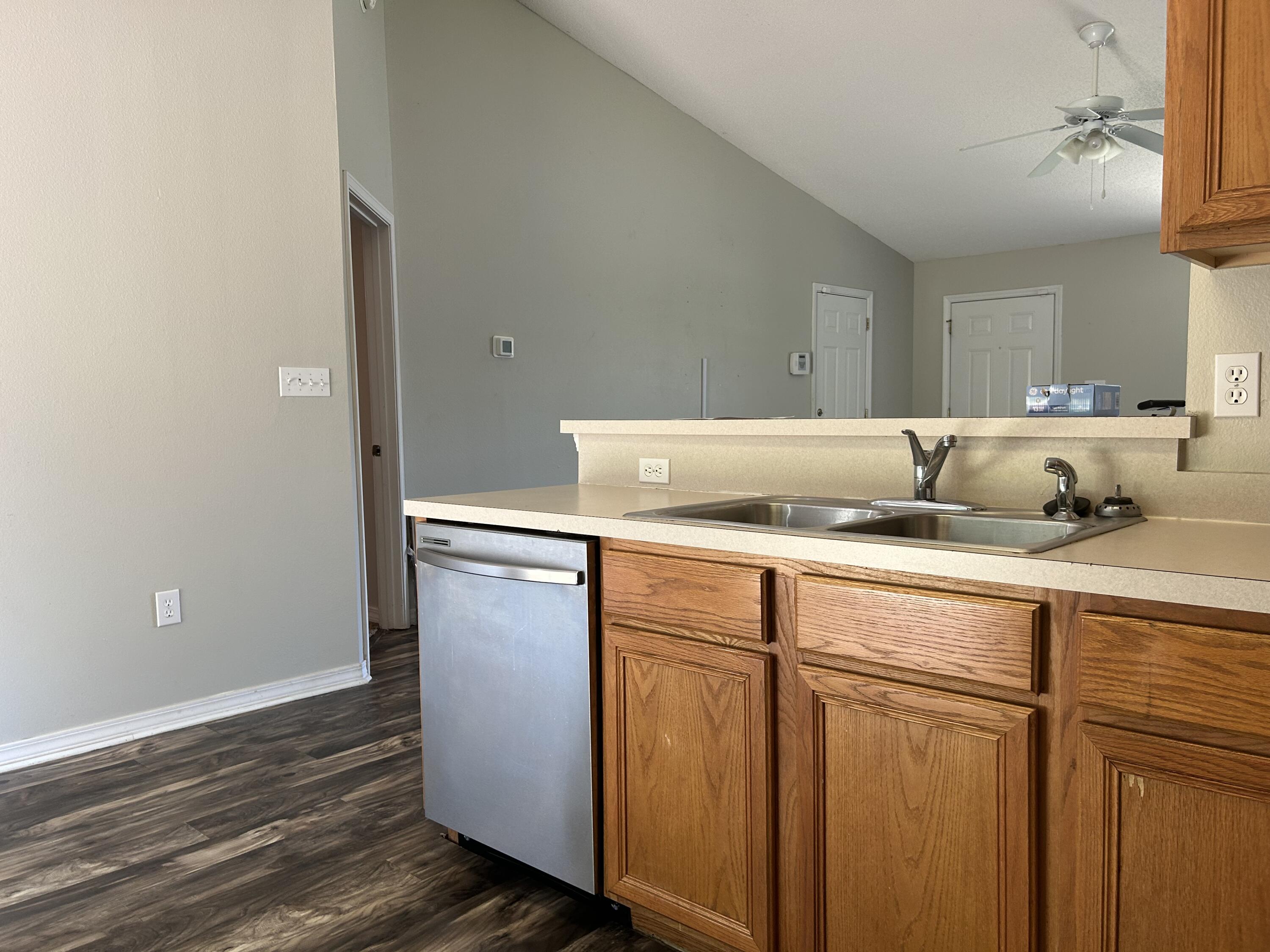 203 Cabana Way Crestview, FL 32536 - Photo 8 of 25 a kitchen with a sink and wooden floor