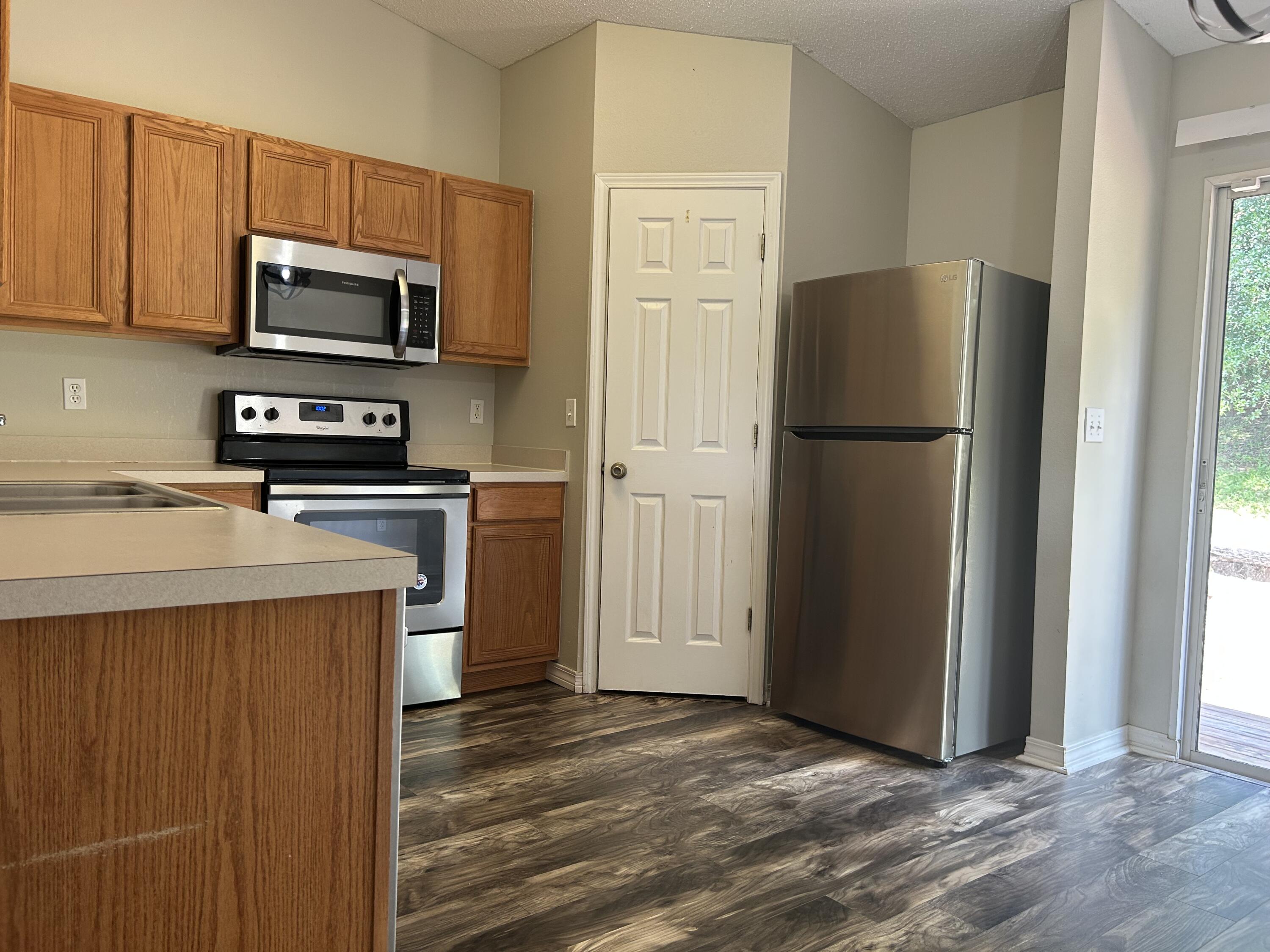 203 Cabana Way Crestview, FL 32536 - Photo 9 of 25 a kitchen with a refrigerator sink and microwave
