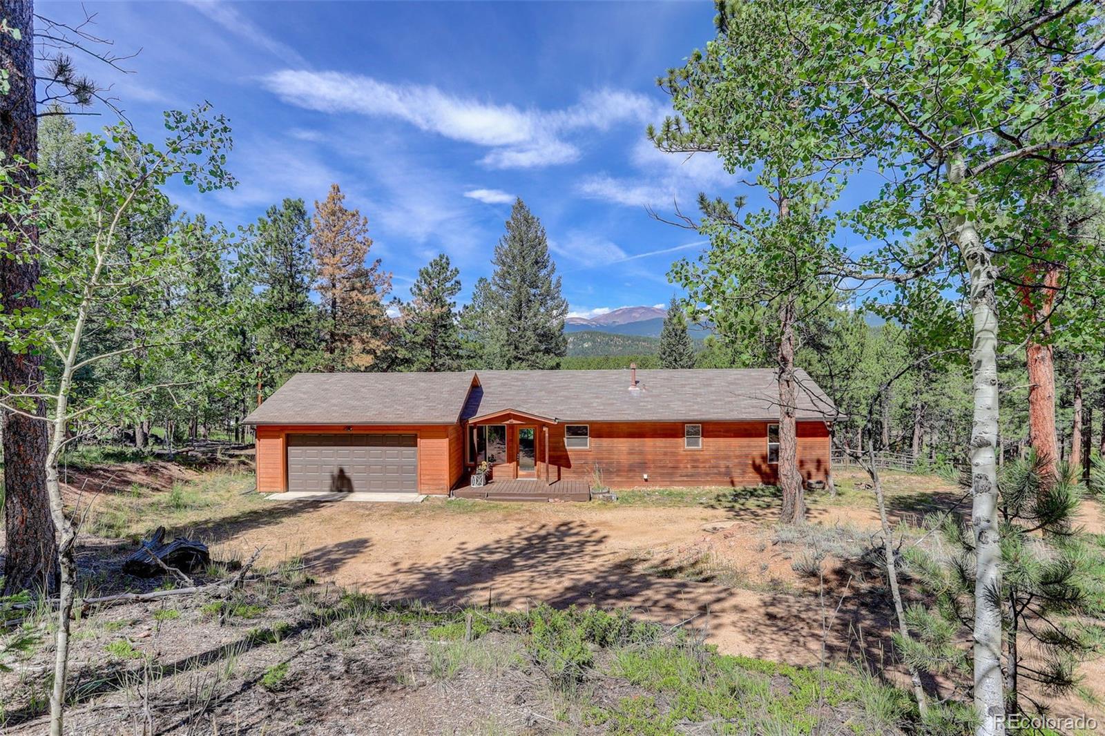 307 Hitchrack Road Bailey, CO 80421 - Photo 2 of 30 a view of a house with a yard