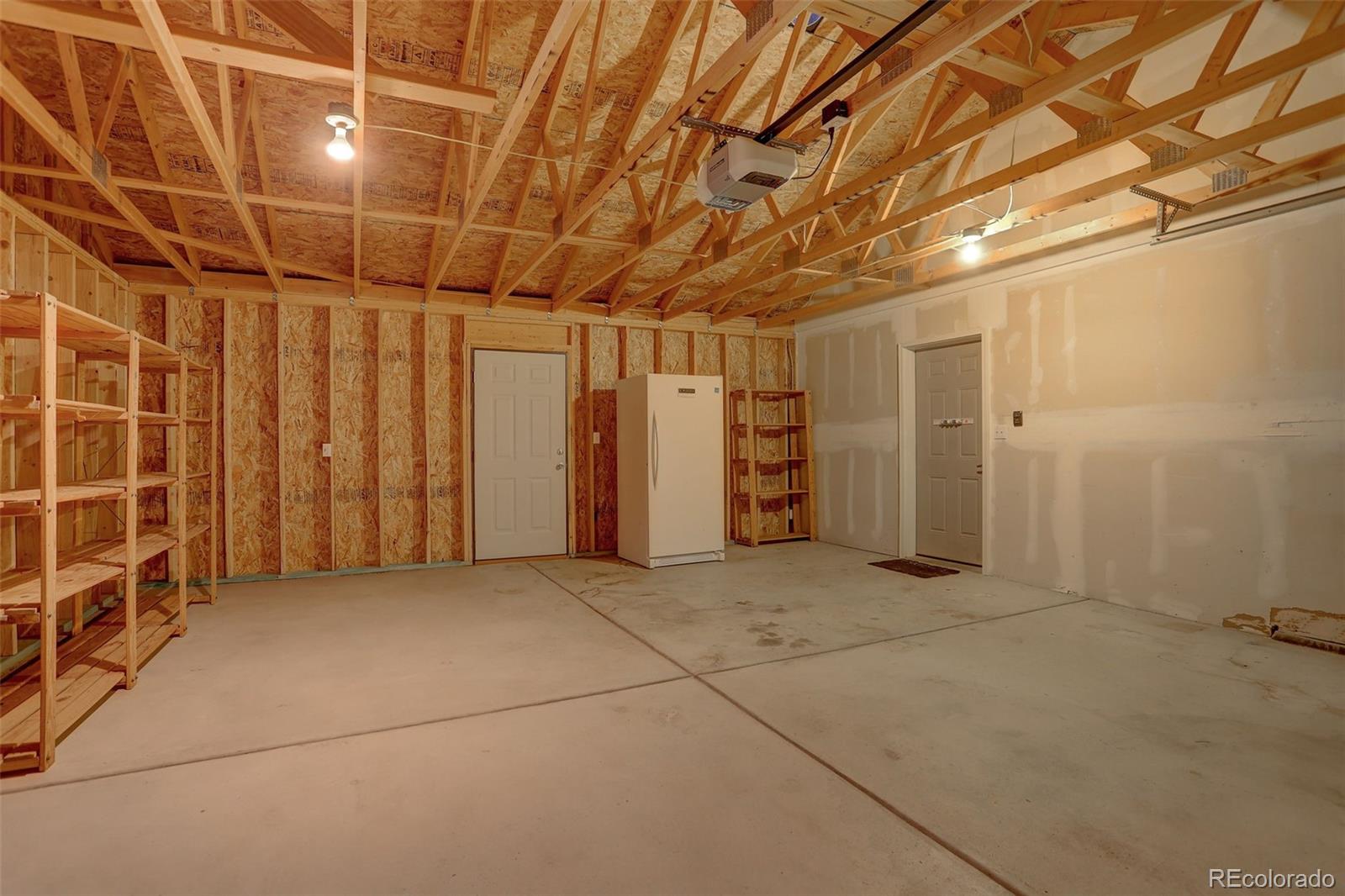 307 Hitchrack Road Bailey, CO 80421 - Photo 27 of 30 a view of a livingroom with a garage
