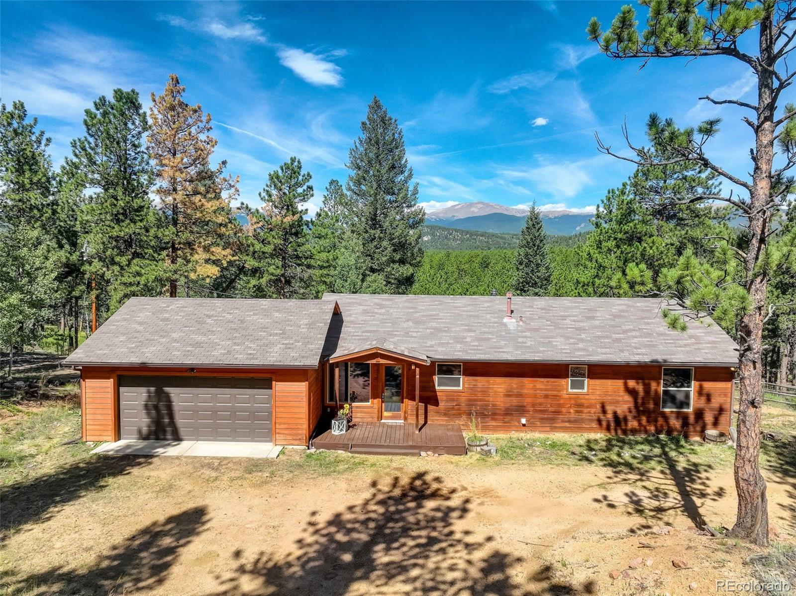 307 Hitchrack Road Bailey, CO 80421 - Photo 3 of 30 a view of a house with a yard
