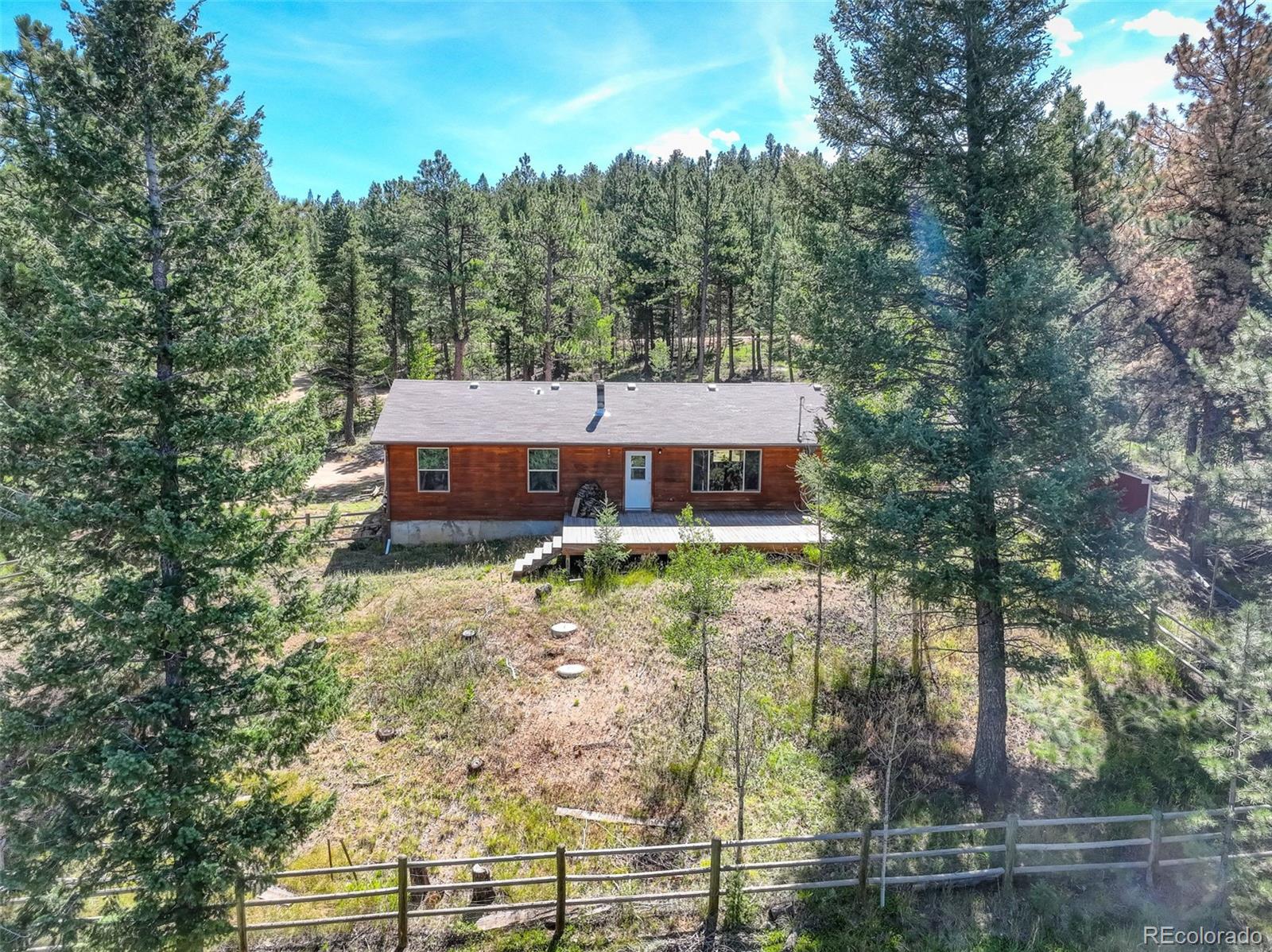307 Hitchrack Road Bailey, CO 80421 - Photo 4 of 30 front view of a house with a yard