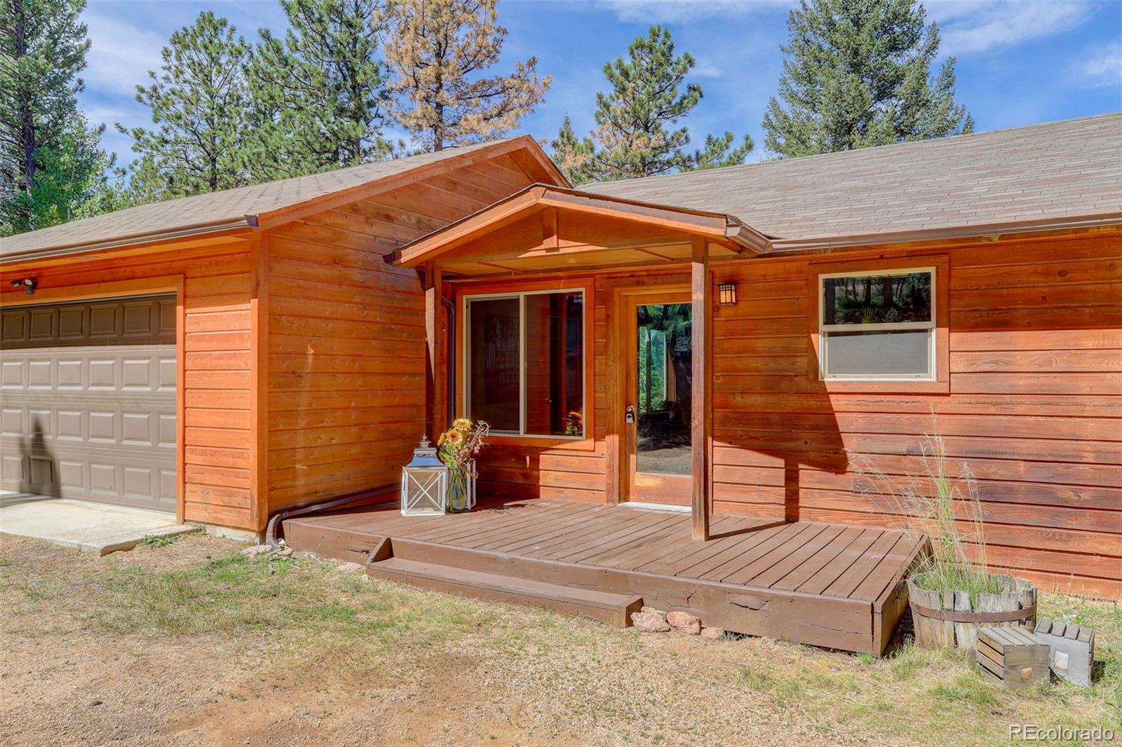 307 Hitchrack Road Bailey, CO 80421 - Photo 7 of 30 a view of a house with backyard and sitting area