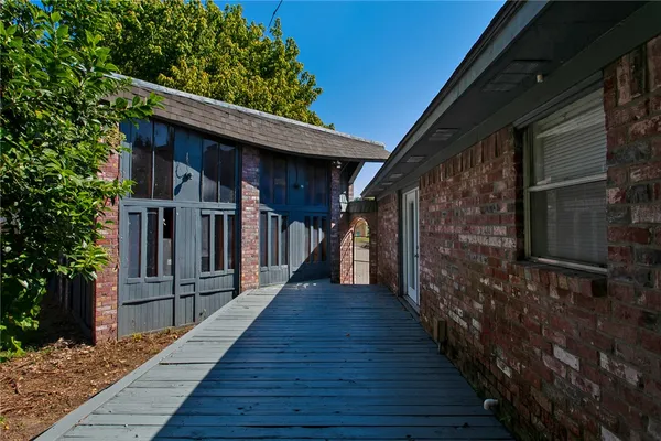 a view of a house with wooden stairs
