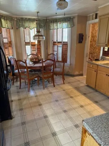 a view of a livingroom with furniture window and wooden floor