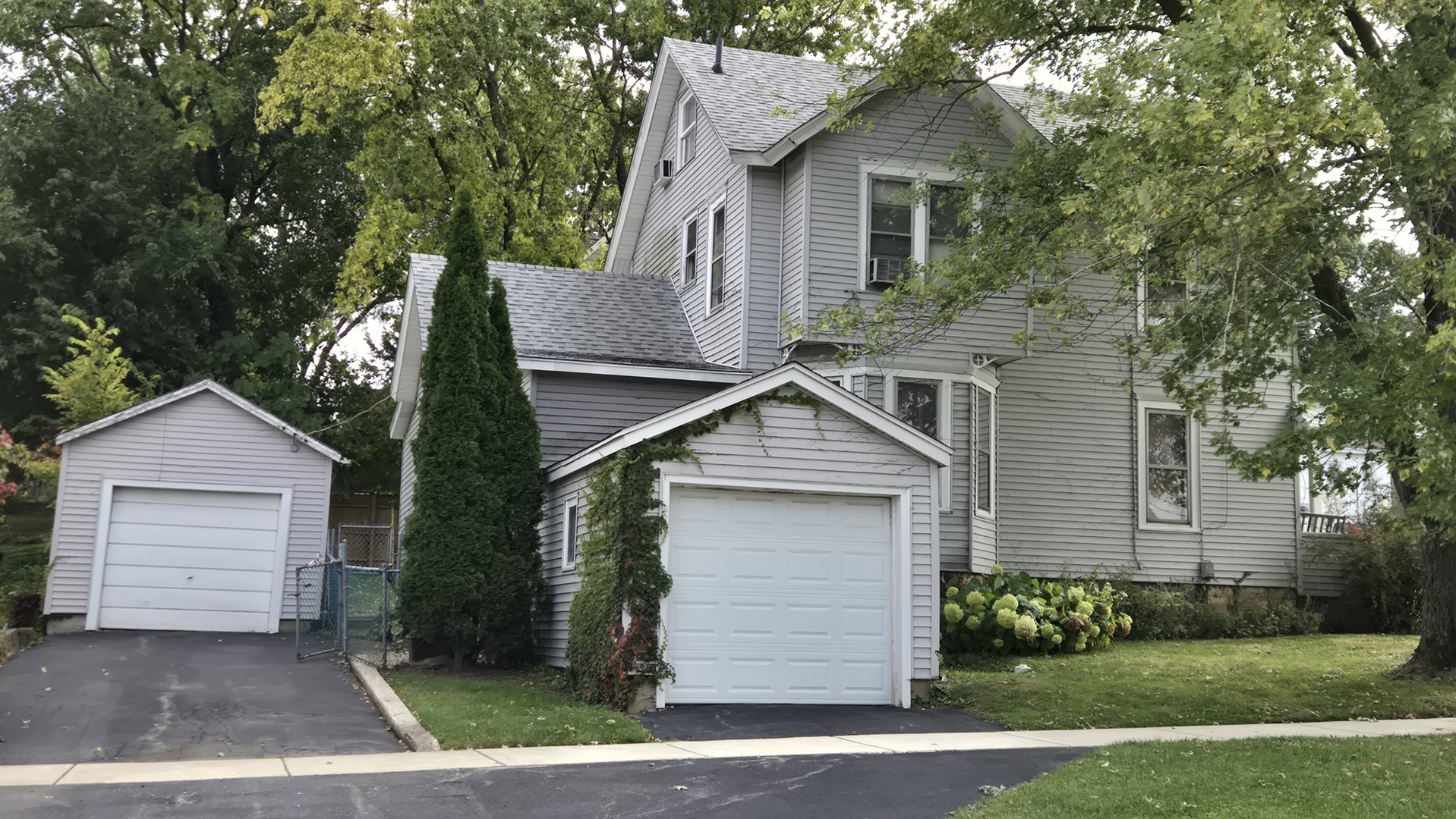 202 East 14th Street Lockport, IL 60441 - Photo 2 of 17 a front view of a house with a yard and garage