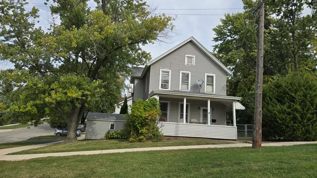 a view of house with yard
