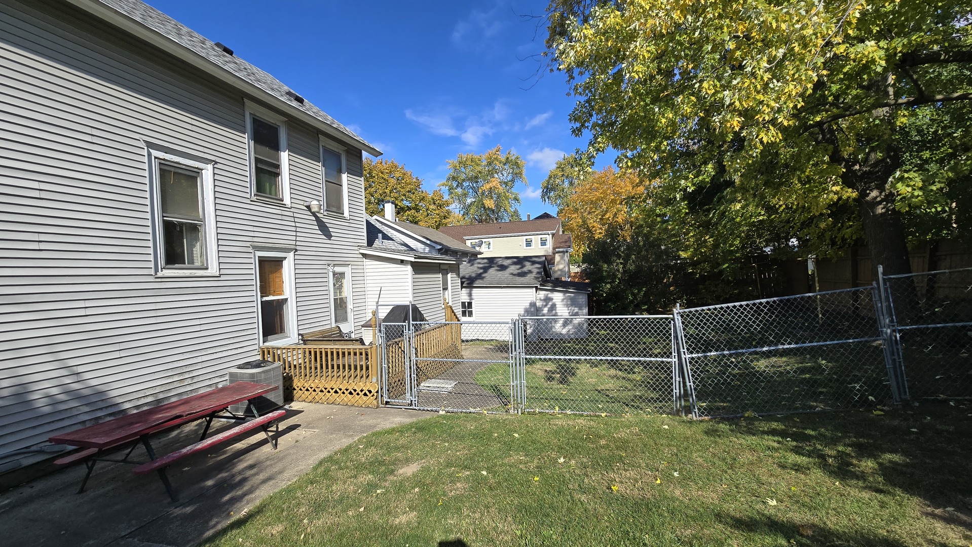 202 East 14th Street Lockport, IL 60441 - Photo 5 of 17 a backyard of a house with table and chairs