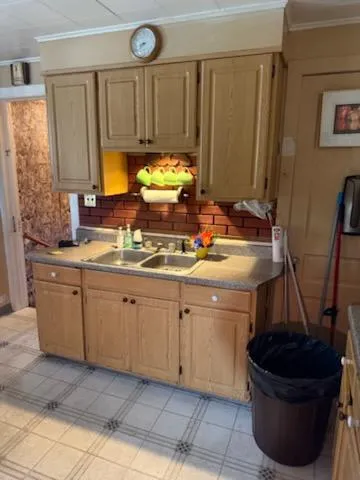 a kitchen with a sink stove and cabinets