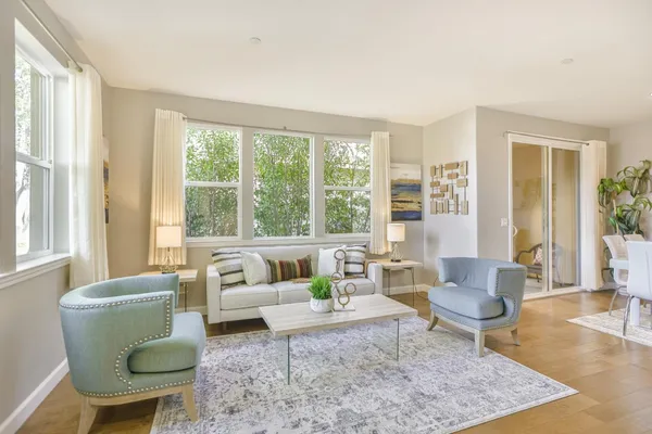 a living room with furniture and a large window