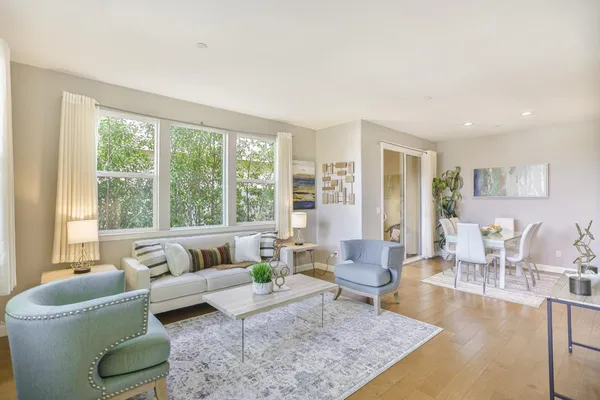 a living room with furniture and a large window