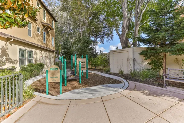 a view of yard with swimming pool and green space