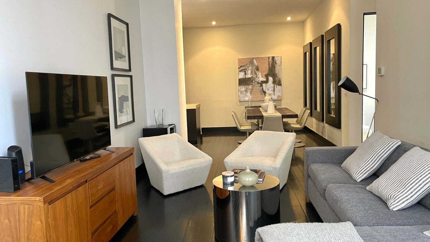 254 Park Avenue South, Unit 6A Manhattan, NY 10010 - Photo 3 of 9 a living room with furniture and a flat screen tv