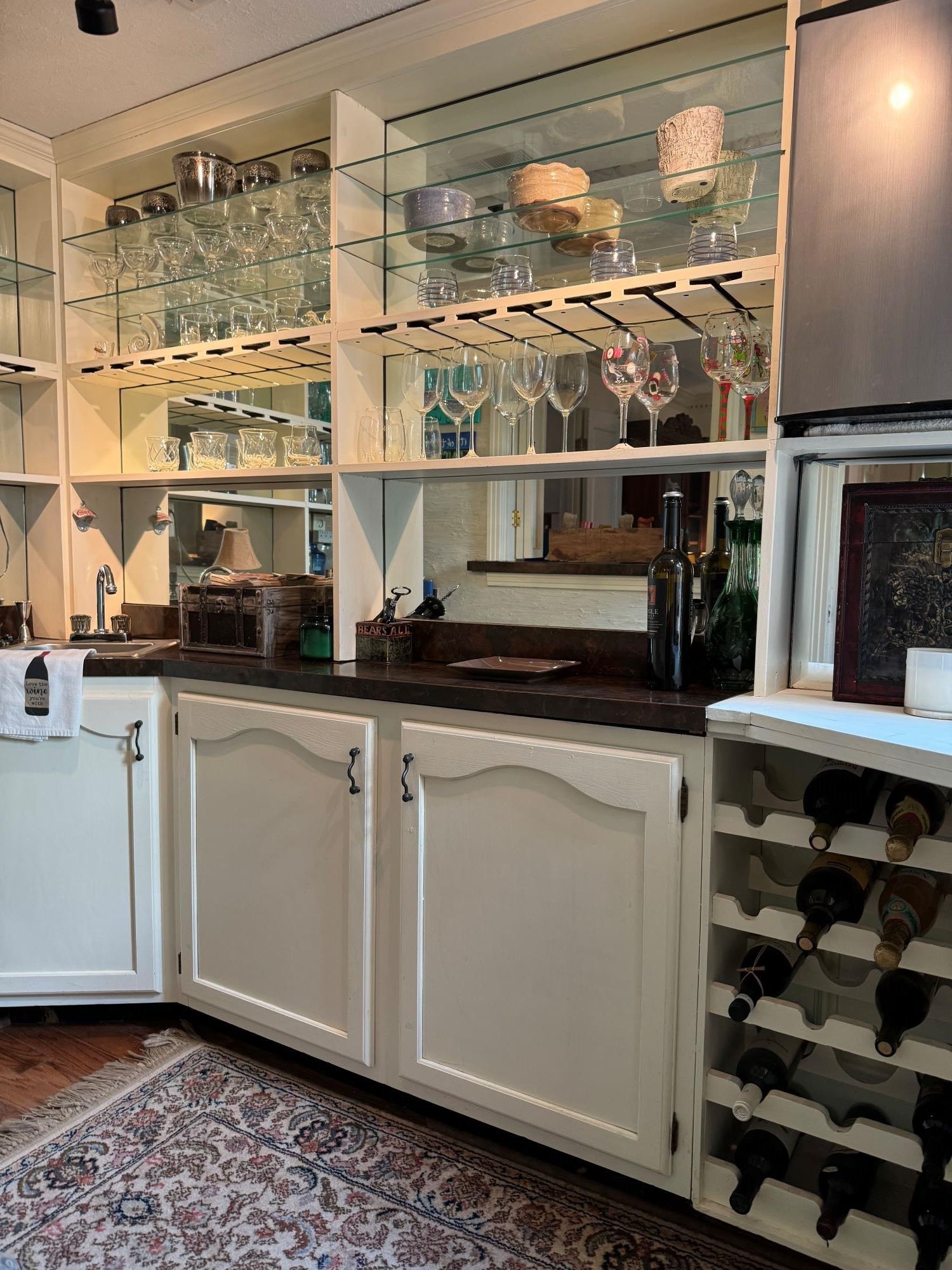 2695 Brook Bridge Cove Germantown, TN 38138 - Photo 11 of 40 Walk-in bar features wine rack, mini fridge, sink, stem holders and lots of cabinets.