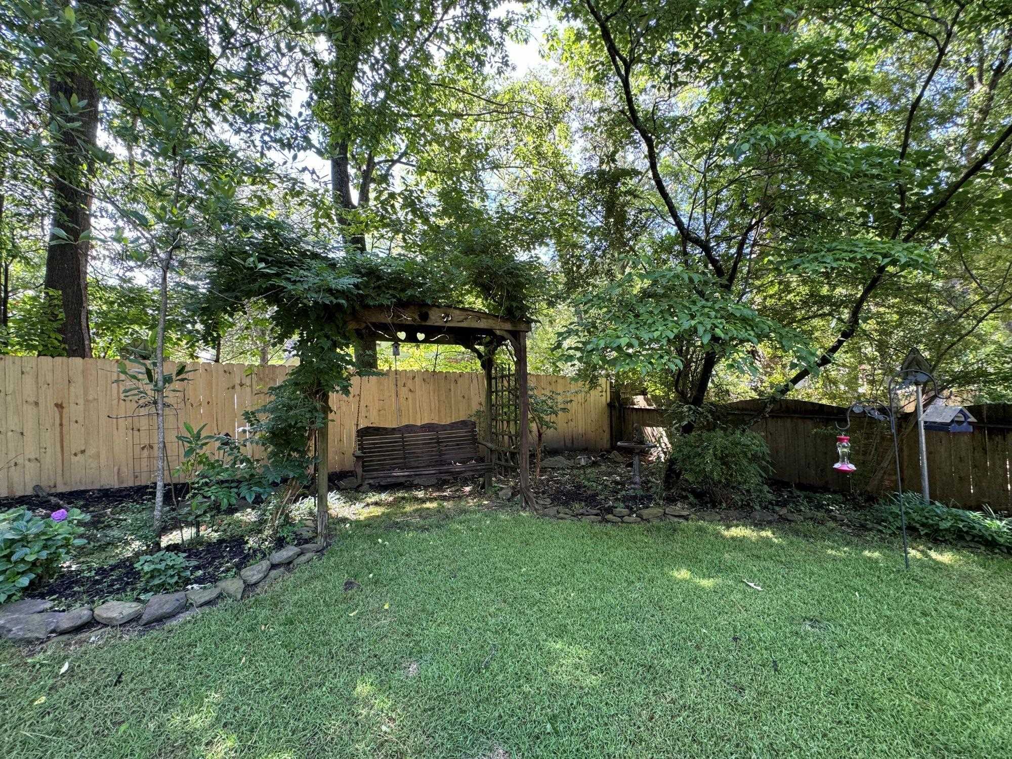 2695 Brook Bridge Cove Germantown, TN 38138 - Photo 34 of 40 Enjoy this beautiful weather and this gorgeous yard in your backyard swing.