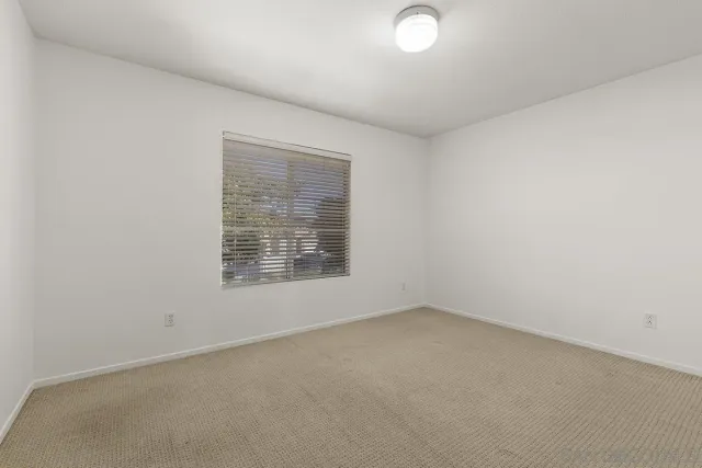 a view of a patio with couches and a fire pit