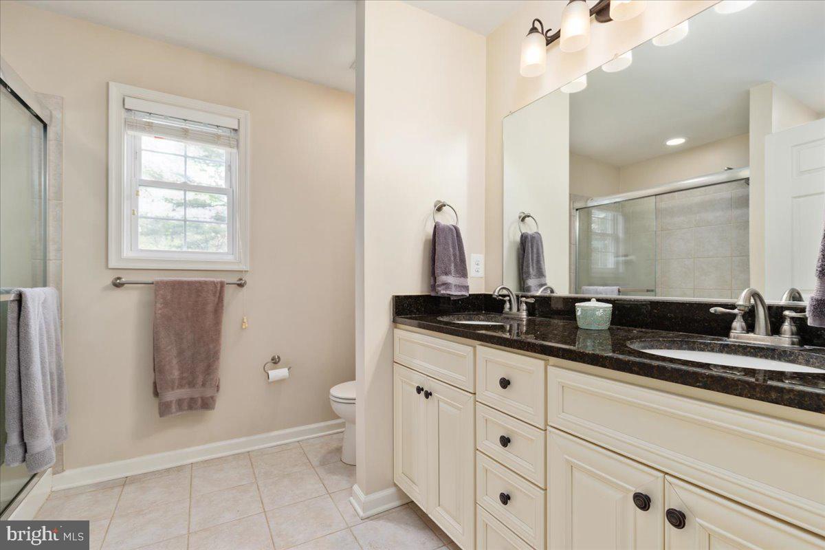 220 Deerhaven Road Front Royal, VA 22630 - Photo 11 of 34 a bathroom with double sink and a mirror