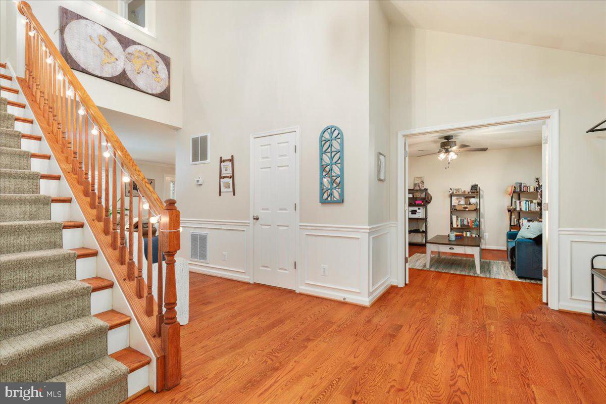 220 Deerhaven Road Front Royal, VA 22630 - Photo 7 of 34 a view of a room with wooden floor and stairs