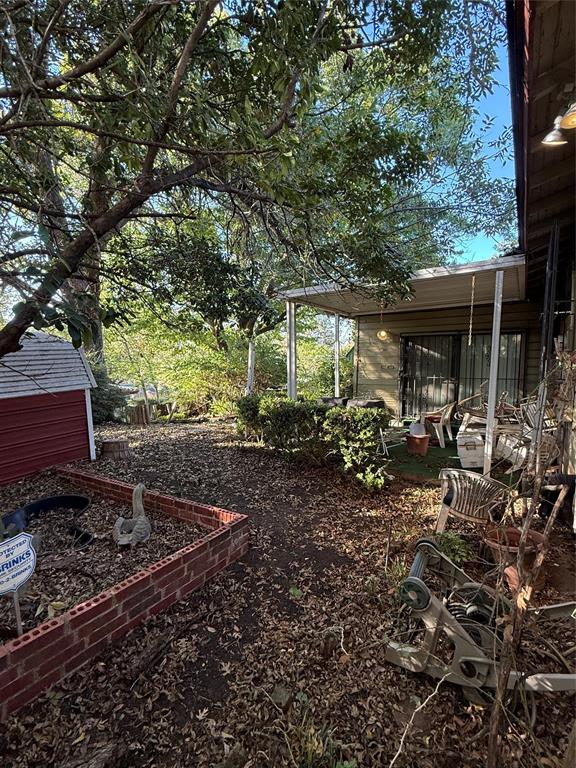 12039 Schroeder Road Dallas, TX 75243 - Photo 21 of 29 a view of a backyard with sitting area