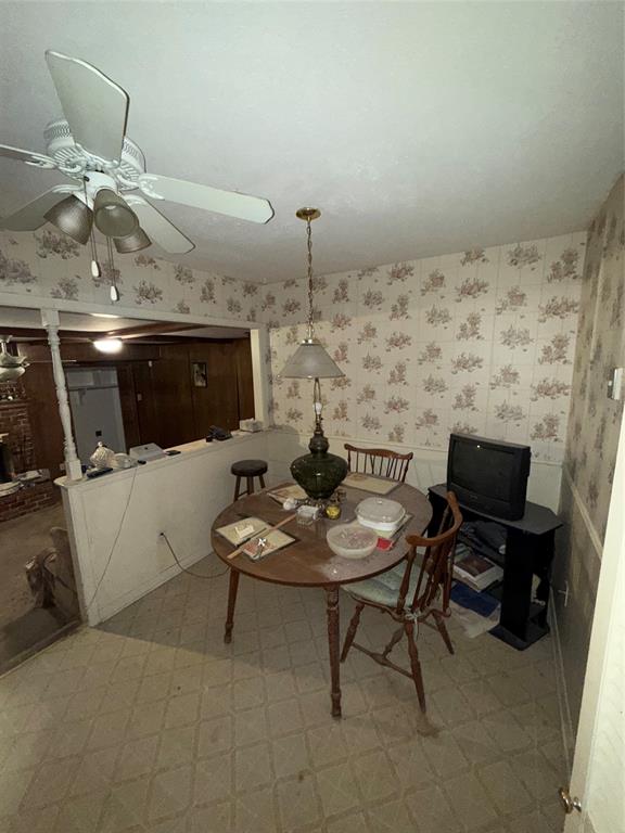 12039 Schroeder Road Dallas, TX 75243 - Photo 9 of 29 a living room with furniture and a flat screen tv