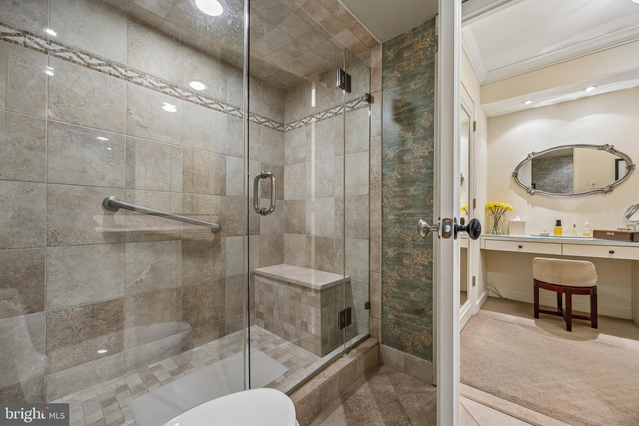 41 Conshohocken State Road, Unit 603 Bala Cynwyd, PA 19004 - Photo 19 of 37 a bathroom with a shower sink and mirror