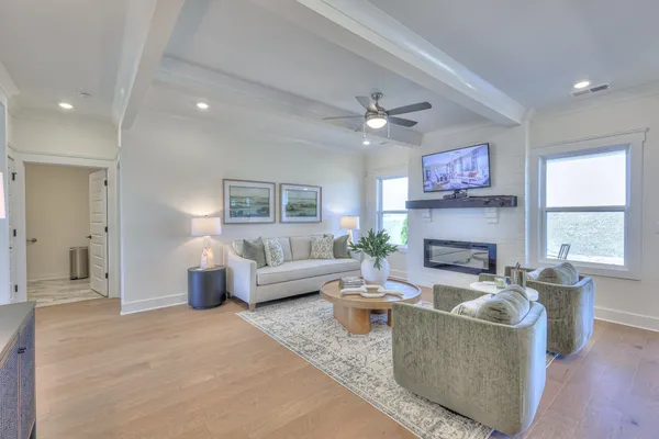 a kitchen with stainless steel appliances granite countertop a stove a kitchen island a stove a table and chairs