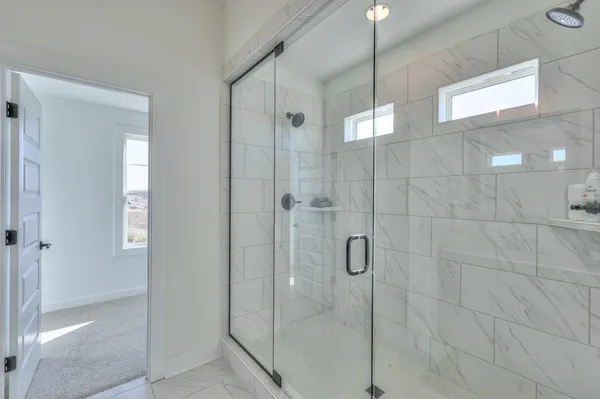 a bathroom with a bathtub and a toilet