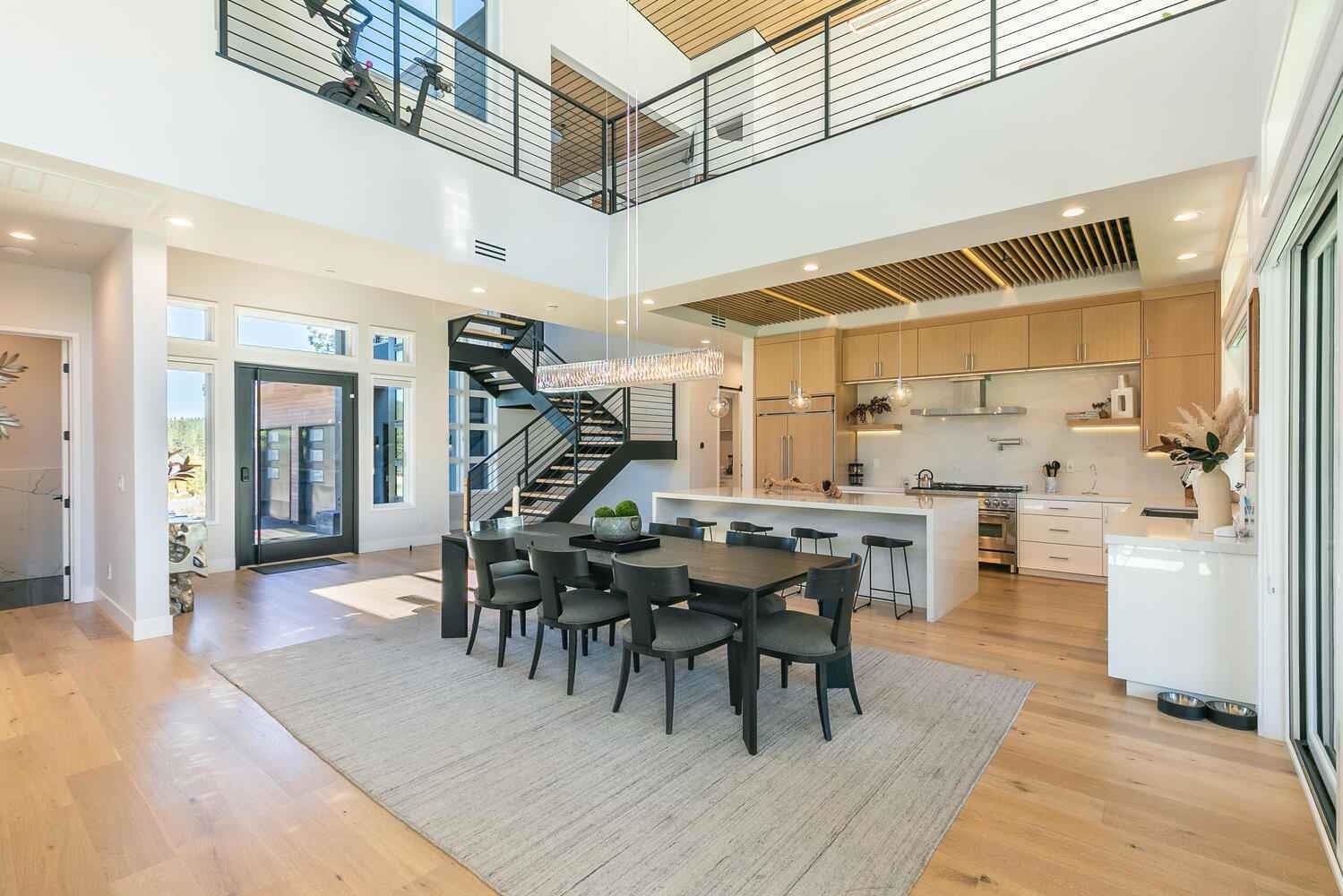 11614 Henness Road, Unit SHARE B Truckee, CA 96161 - Photo 15 of 28 a dining hall with stainless steel appliances kitchen island granite countertop a dining table chairs and chandelier