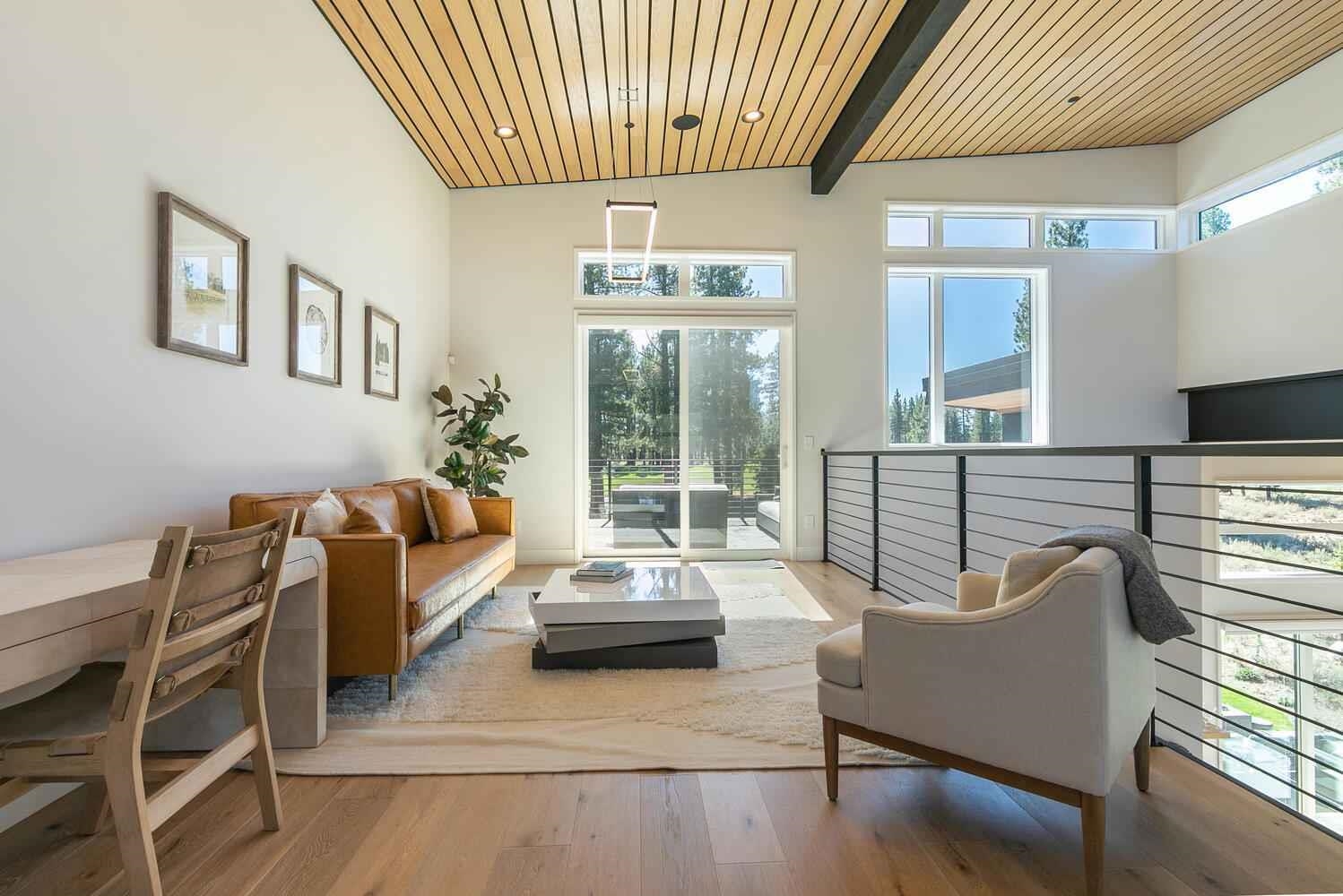 11614 Henness Road, Unit SHARE B Truckee, CA 96161 - Photo 25 of 28 a living room with furniture and a large window