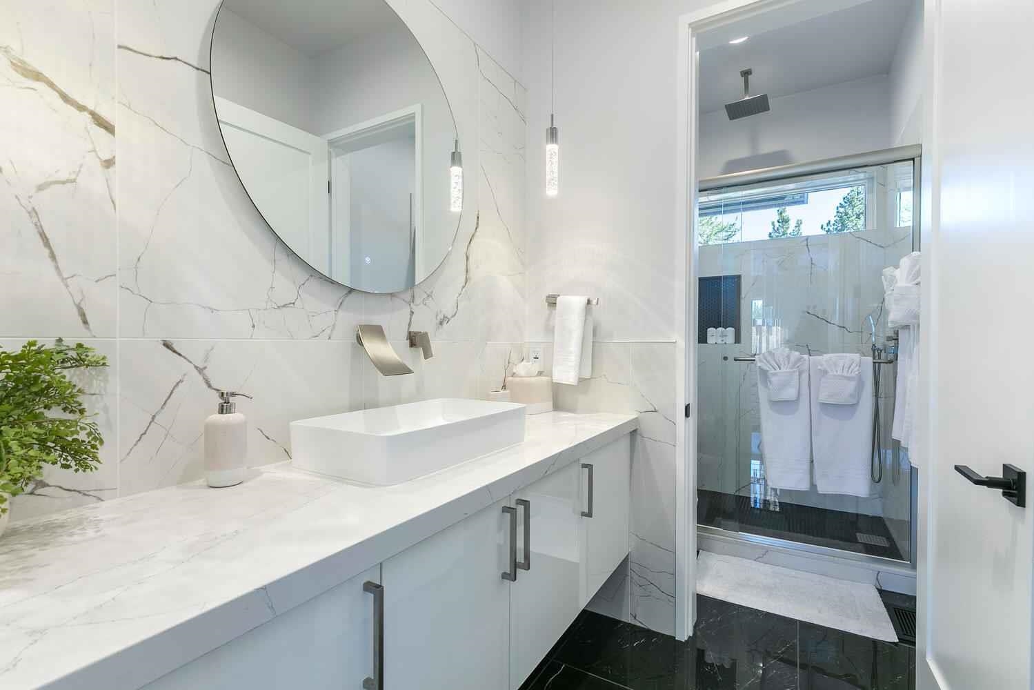 11614 Henness Road, Unit SHARE B Truckee, CA 96161 - Photo 28 of 28 a bathroom with a sink and a mirror