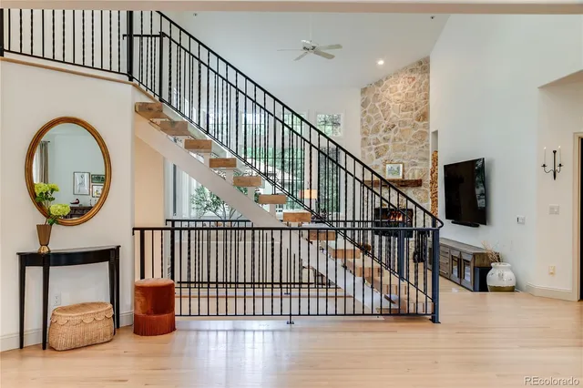 a view of entryway livingroom and hall with wooden floor