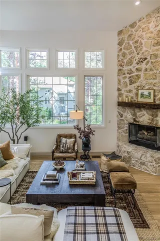 a living room with furniture and a fireplace