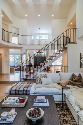 a living room with furniture and a table