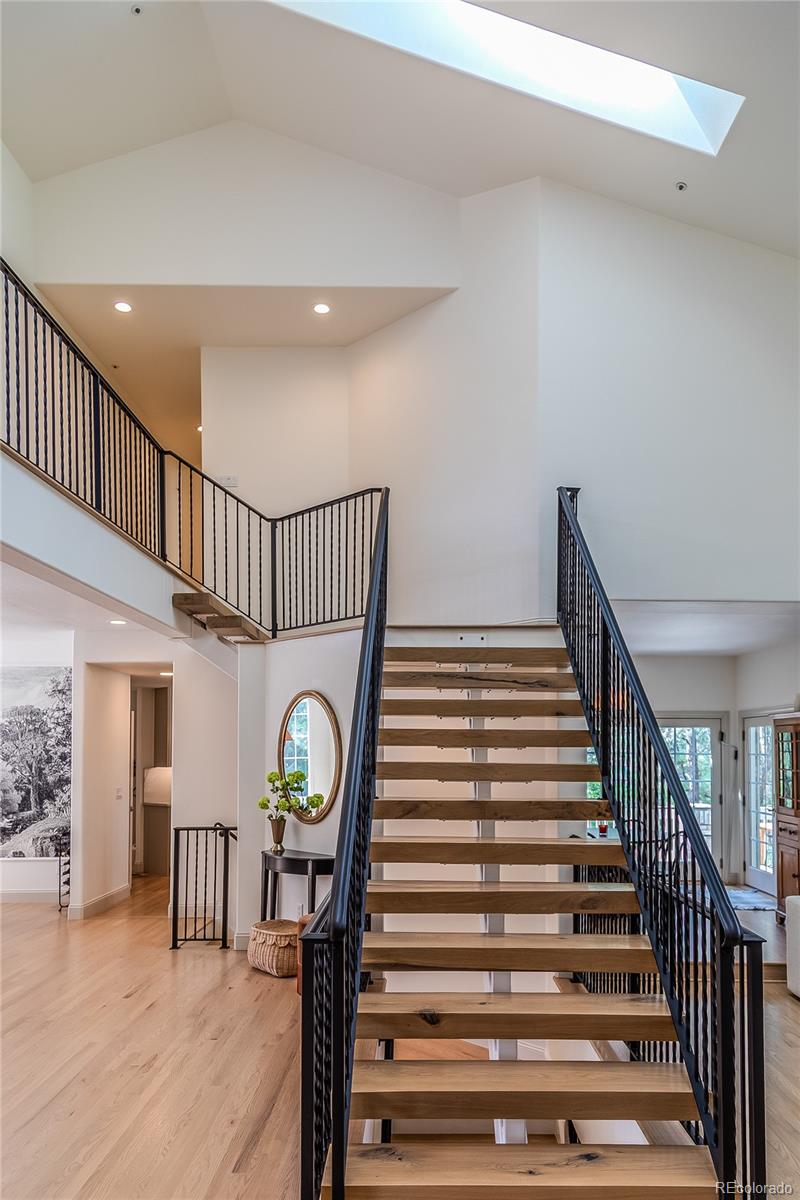 475 Silbrico Way Castle Rock, CO 80108 - Photo 18 of 50 a view of entryway livingroom and hall with wooden floor