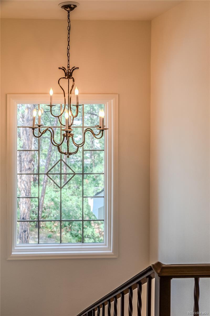 475 Silbrico Way Castle Rock, CO 80108 - Photo 20 of 50 a view of a balcony with a glass top table and chairs