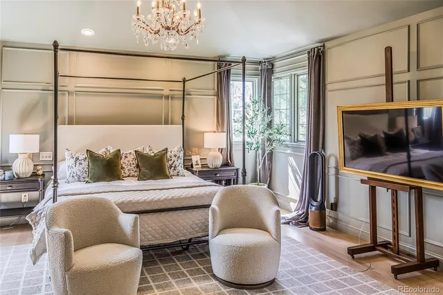 a bedroom with a bed and glass table