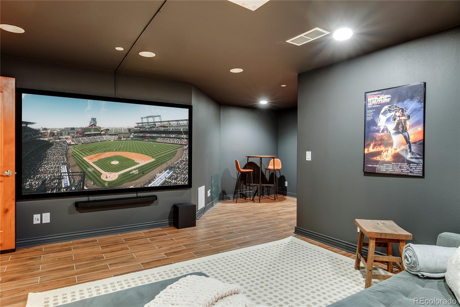475 Silbrico Way Castle Rock, CO 80108 - Photo 43 of 50 a room with furniture and a flat screen tv