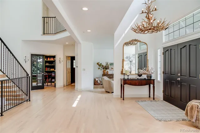 a view of a livingroom with furniture and staircase