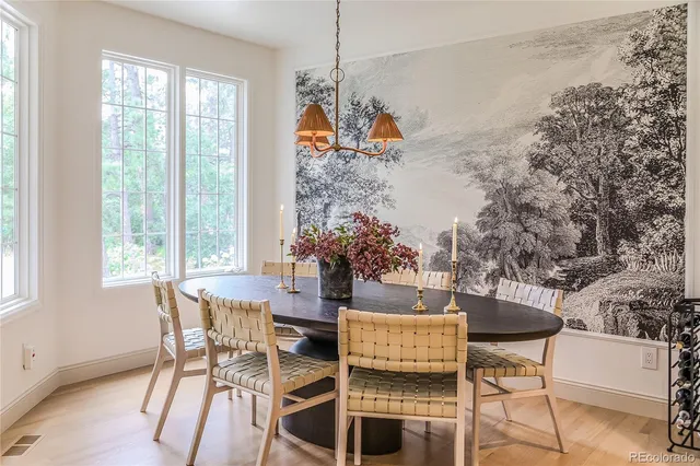a dining room with furniture and window